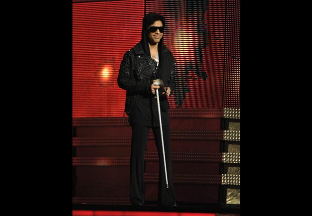 Prince presents the award for record of the year on stage, Gramm